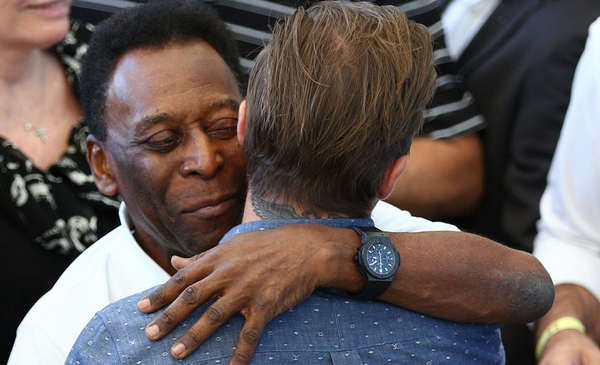 Stars of the game: Former Brazilian internationals Kaka and Pele with Beckham before