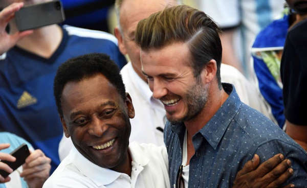 Stars of the game: Former Brazilian internationals Kaka and Pele with Beckham before